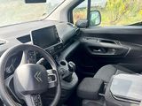 the interior of a car with a steering wheel and dashboard