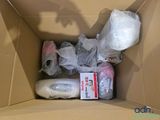 a cardboard box filled with a lot of items