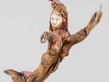 sculpture of a woman floating on a wooden base on a gray background