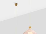 a pair of pink and gold pendant lights hanging from the ceiling