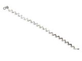 a close up of a silver bracelet on a white background