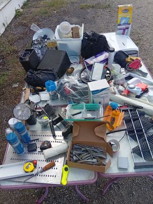 a table with a lot of junk on top of it