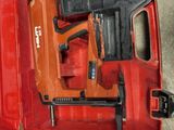 a red tool box with a stapler and a stapler in it