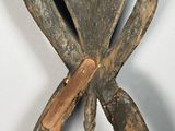 a wooden chair with a wooden handle and a clock on the back of it