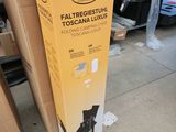 a box that is sitting on the ground next to a pile of boxes