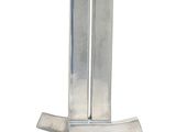 a metal object that is sitting on a white surface