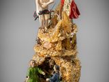 une image représentant une statue d'un homme et d'une femme sur un rocher