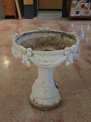 a bird bath sitting on the floor in a store
