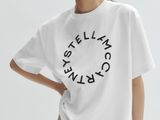 a woman wearing a white t - shirt with the words ' still thinking ' printed on it