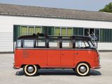 a red vw bus that is parked in front of a building