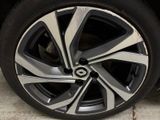 a close up view of a car ' s wheel on the ground