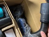 a person holding a blow dryer in a box