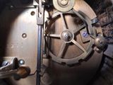 a close up of a metal object inside of a machine