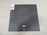 a close up of a black book on a white surface