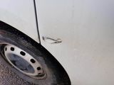 a close up of a car tire with a hole in the tire