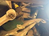a pile of old skateboards and other skateboards in a room