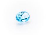 a blue topaze gems on a white background