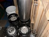 several kegs are stacked on top of each other in a room
