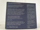 the back of a blue box with information on it on a white surface