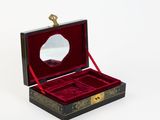 a black box with a mirror in it on a white surface
