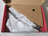 a box with a pair of scissors inside of it
