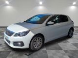 the white car is parked on a checkered floor in the garage