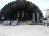 a large metal structure that has a lot of crates in it