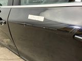 a black car that has a sticker on the door