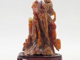 Figurine chinoise en jade sculpté représentant un homme et une femme sur une souche d'arbre