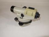 a white and black tripod on a white surface