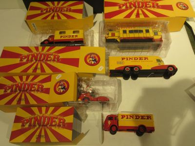 many different types of toy trucks on the table