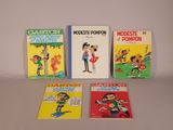 quatre livres pour enfants sont alignés sur une table