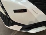 a close up of a car with a sticker on it