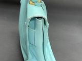 the back of a blue purse with a gold handle