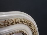 a close up view of a mirror in the corner of a room