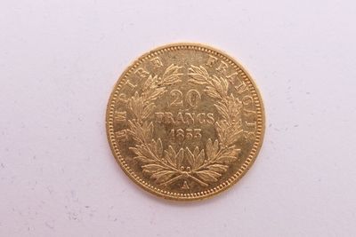 une image d'une pièce d'or sur une surface blanche