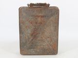an old metal suitcase sitting on top of a white surface