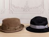 two hats that are sitting on a table