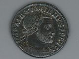 a close up of a coin with a man ' s face on it