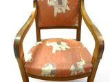 an image of a wooden chair with an elephant pattern on it