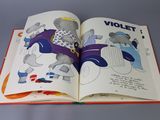 an open book with a picture of a cartoon character on it