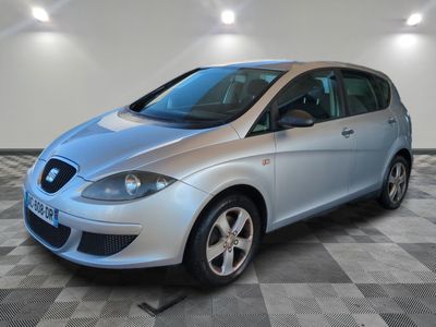 a picture of a silver car parked in a garage