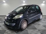 a picture of a small black car on a checkered floor