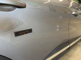 a close up of a car door with a sticker on it