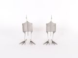 pair of silver plated bird legs on a white background