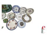 a lot of plates that are sitting on a table