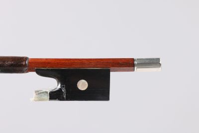 violin bow made of wood and metal on a white background