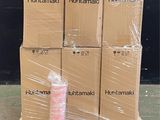 boxes stacked on pallets in a warehouse with plastic wrap around them