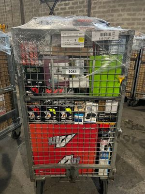 a metal cart with many items in it in a warehouse