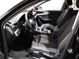 the interior of a car with a black leather seat and dashboard